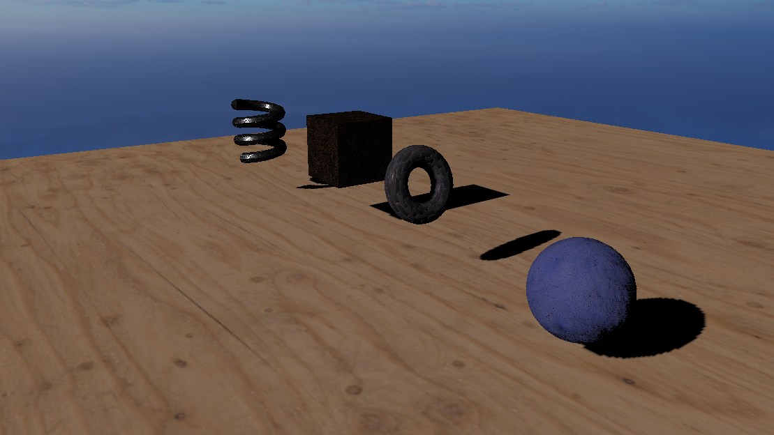 A lit scene on a wooden floor under a sky: a metal spring, a rough cube, a torus and a blue sphere, each casting a shadow.